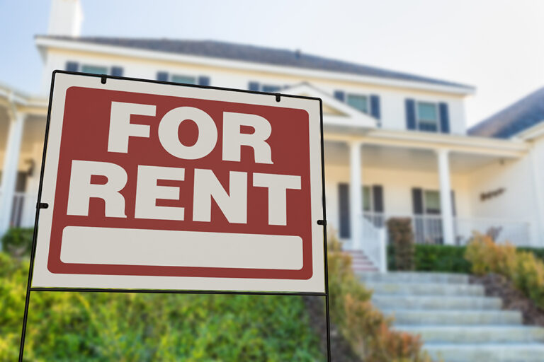 Rental property with a 'For Rent" sign outside